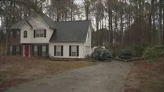 Man hospitalized after tree falls on car