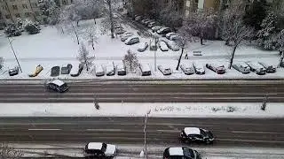 Slow-Motion Footage Of A Snow-Covered Urban Street | OrangeHD.com