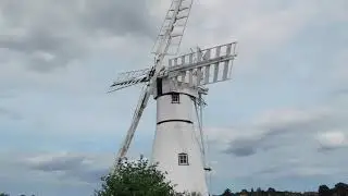 Thurne Mill and the passing boats
