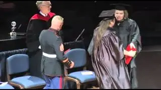 Marine Michael Burkhart surprises sister Kacy D. Watson with diploma.