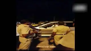 Former MP K Arjunan hits a police personnel on duty near Salem check-post