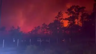 RAW VIDEO: Boiling Spring Lakes wildfire near NC coast Saturday night (Southport Police Dept.)