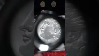 1898 O Morgan dollar through a Jeweler's Loupe. Problem with the coin.