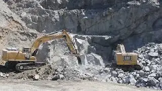 Cat 336F and Cat 374F Moving Blasted Rock