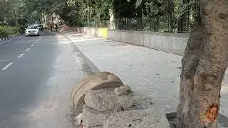 PEDESTRIANS' LIVES IN DANGER; NO FOOTPATH ON A BUSY ROAD.