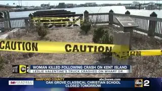 Police investigate woman's body found in water near truck crash