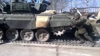 Soldiers pushing the 46 tone T-90A MBT for Track Replacement