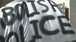 Anti-police sign hung on Central near UNM