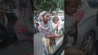 Roadside homeless - single mothers with little babies begging for food and life