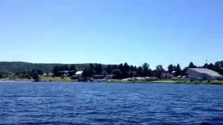 Dhc-3 otter floatplane water landing seen from a pedalboat