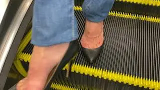 #1912111274 featuring Zara HH on an escalator