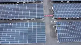 Autonomous solar clean robots are cleaning the Car parking plant, carport. Amazing!