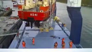 Timelapse heavy lift ship Deo Volente loading navy ship in Nuuk, Greenland