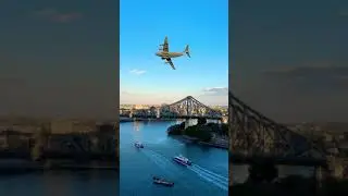 Huge plane flies low through city