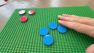 Simplifying fractions with two-sided counters