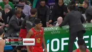 Marcus Smart jumps into the crowd for a loose ball