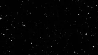 Low angle slow speed, alpha channel, seamless loop | Falling of realistic snow, black background