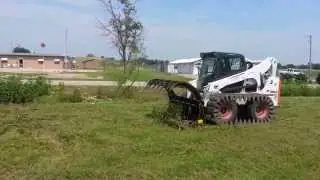 Hydra Rake Brush Rake on Bobcat Skid Loader