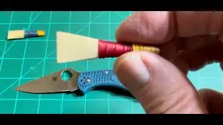 Очистка трости волынки с помощью Spyderco Delica