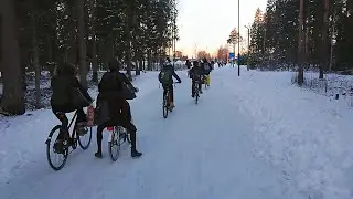 Morning rush: kids cycling to school in winter in Oulu, Finland