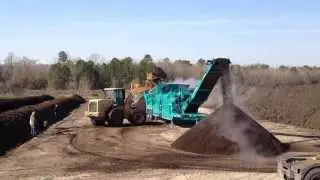 Powerscreen Phoenix 2100 screening compost at 1/2