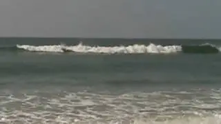 surfing at holden beach