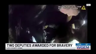 2 Lee County deputies recognized for heroism after car left dangling over embankment