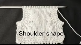 Knitting arm hole (Shoulder ) for a baby's cardigan with a border. Knit arm hole with border.