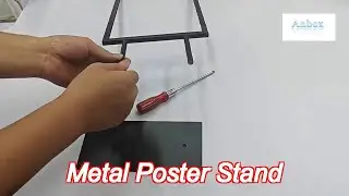 black countertop frame displays a4 graphics metal poster holder on table