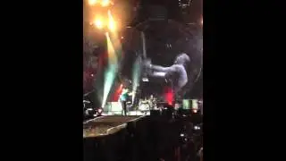 Chris Martin throws his guitar on Turin's stage