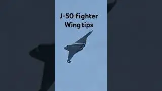 J-50 fighter wingtips movement in test flight.