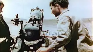 United States soldiers fire a 75mm pack howitzer at a field in Saipan, Pacific. HD Stock Footage