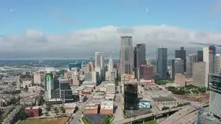 Aerial view tall modern office buildings downtown. Group of skyscrapers behind highway. Pedestal