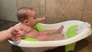 Baby Splashing in Bathtub
