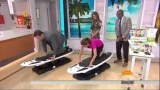 Natalie Morales - surfing in a slit skirt & no high heels - September 12, 2014