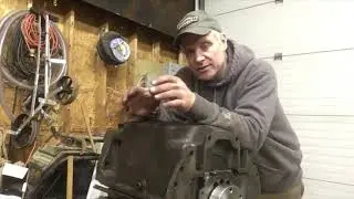 Installing the oil pan on the Massey 231 /Perkins 152 engine.