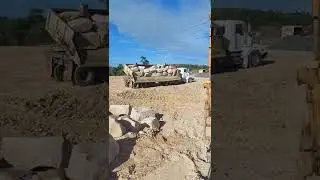 side tipper tipping sandstone rock