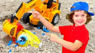 Nikita  playing on the Beach with Sand and other Kids Toys