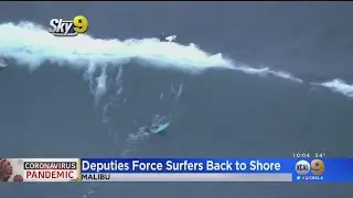 Coronavirus: Deputies Force Group Of Surfers Back To Shore