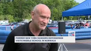 Former Rangers defenseman Tom Laidlaw plays ball hockey with Norwalk students