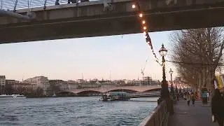 View down the south bank of the River Thames, London 4K