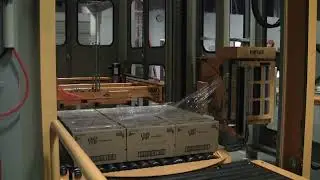 Concurrent stretch wrapping using bottom slip sheet for loads not requiring pallet