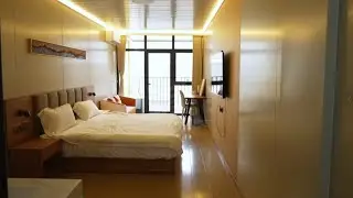 Hotel rooms made of foldable/flat pack container houses.