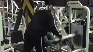 Neale Cranwell being trained by Nathan Harman demonstrating lying hamstring curl