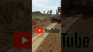 caterpillar grader soil pushing
