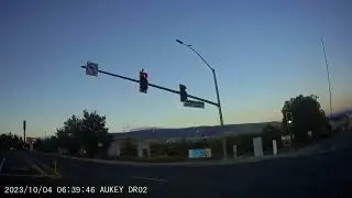 Reno Police Department Squad car running red light at Kitzkie/580S interchange in Reno, Nevada.