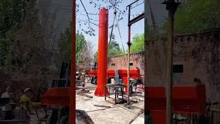 Rotating suspended boom crane