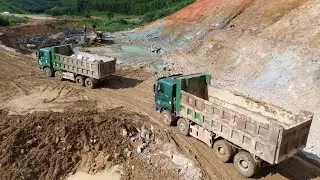 Heavy-duty dump trucks hauling soil at the construction site &ndash; power and productivity in motion!