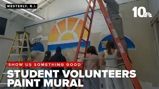 High school students volunteer to paint mural at animal shelter