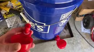 Poultry watering cups installed on a 5 gallon bucket RentACoop 4 pack automatic chicken kit